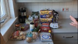 A picture of groceries laid out on a kitchen counter top